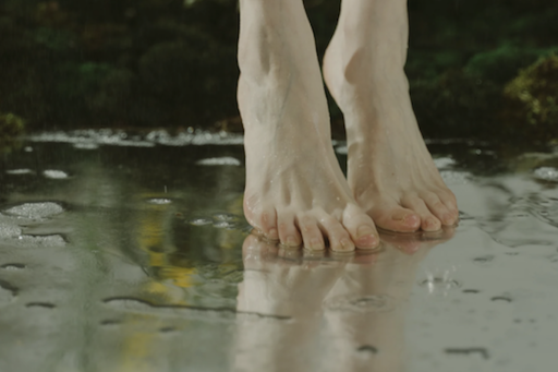 Foot touching calm water, symbolizing the moment of obedience and faith that moves God’s hand.
